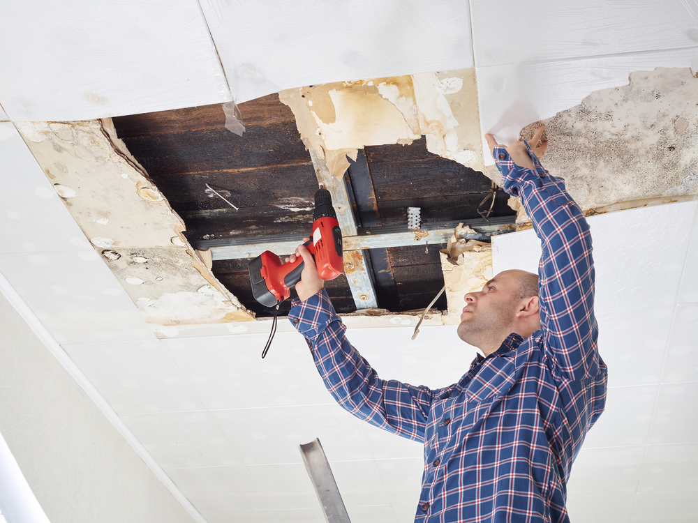 Water damage in home showing walls and floors affected by flooding