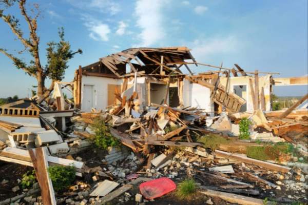 Severe property damage caused by a water heater explosion.