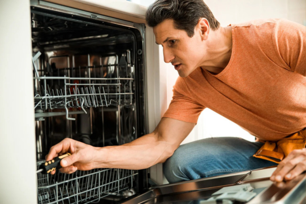 Damaged dishwasher door seal with cracks leading to water leaks.